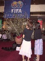 Cherry blossom arrangements made to welcome soccer fans